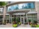Building entrance surrounded by seasonal plants at 1080 Peachtree Ne St # 2710, Atlanta, GA 30309