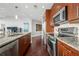Functional kitchen featuring modern stainless steel appliances, granite countertops, and hardwood floors, offering a sleek cooking space at 1080 Peachtree Ne St # 2710, Atlanta, GA 30309