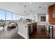 Modern kitchen featuring stainless steel appliances, a breakfast bar with seating, and an open layout flowing into the living area at 1080 Peachtree Ne St # 2710, Atlanta, GA 30309