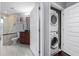Convenient in-unit stacked washer and dryer in a dedicated laundry closet at 1080 Peachtree Ne St # 2710, Atlanta, GA 30309