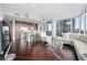 Open-concept living area blending a modern kitchen with a comfortable lounge, featuring sleek cabinetry and contemporary decor at 1080 Peachtree Ne St # 2710, Atlanta, GA 30309
