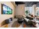 Relaxing lounge area offering comfortable couches, modern furniture, and a large wall-mounted TV at 1080 Peachtree Ne St # 2710, Atlanta, GA 30309