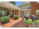 Brick patio with outdoor seating, lush greenery, and a view of the backyard at 4045 Boles Creek Dr, Duluth, GA 30096