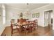 Formal dining room with a chandelier, hardwood floors, and seating for eight at 4045 Boles Creek Dr, Duluth, GA 30096