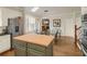 Bright eat-in kitchen with stainless steel appliances, butcher block island, and hardwood floors at 4045 Boles Creek Dr, Duluth, GA 30096