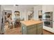 Open-concept kitchen with stainless steel appliances and butcher block island, adjacent to dining area at 4045 Boles Creek Dr, Duluth, GA 30096