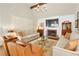 Cozy living room featuring fireplace, plush seating, and bright light from shuttered windows at 4045 Boles Creek Dr, Duluth, GA 30096