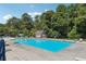 Resort-style community pool with ample lounge chairs and clear blue water for relaxation and recreation at 4369 Milford Pl, Hoschton, GA 30548