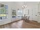 Bright dining area that features natural light, offering an open view to the yard and outdoor spaces at 4369 Milford Pl, Hoschton, GA 30548