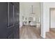 Inviting entryway that displays an open-concept design and hardwood floors, transitioning into the light-filled living area at 4369 Milford Pl, Hoschton, GA 30548