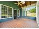 Relaxing screened-in porch with brick flooring, offering a comfortable outdoor space at 4369 Milford Pl, Hoschton, GA 30548