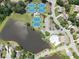 An aerial view featuring a community pool, tennis courts, and a serene lake at 1630 Reindeer Rdg, Alpharetta, GA 30005