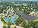 Beautiful community aerial view of tennis courts and a lake, nestled within lush landscaping and serene surroundings at 1630 Reindeer Rdg, Alpharetta, GA 30005