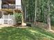 This backyard features a two-story deck surrounded by lush greenery, providing a serene and private outdoor living space at 1630 Reindeer Rdg, Alpharetta, GA 30005