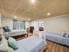 Finished basement bedroom with three beds, light walls, and vinyl plank flooring at 1630 Reindeer Rdg, Alpharetta, GA 30005