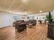 Finished basement with dark leather seating, a pool table in the background, and vinyl plank flooring at 1630 Reindeer Rdg, Alpharetta, GA 30005