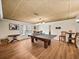Basement gameroom with a ping pong table, window, and vinyl plank flooring at 1630 Reindeer Rdg, Alpharetta, GA 30005