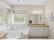Bright bathroom featuring tub, granite counters, sink, and a vanity with ample storage at 1630 Reindeer Rdg, Alpharetta, GA 30005