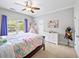 Bright bedroom with bed, window, dresser, play tent, ceiling fan, and decor at 1630 Reindeer Rdg, Alpharetta, GA 30005