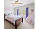 Bright bedroom with bed, window, play tent, ceiling fan, and decor at 1630 Reindeer Rdg, Alpharetta, GA 30005