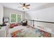 Cozy bonus room with large windows, natural light, neutral carpet, and a round chair for relaxation at 1630 Reindeer Rdg, Alpharetta, GA 30005