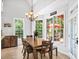 Dining area with chandelier, and views of the patio and backyard at 1630 Reindeer Rdg, Alpharetta, GA 30005