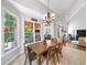Bright dining area with ample windows and views to the outside and living area at 1630 Reindeer Rdg, Alpharetta, GA 30005