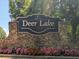 Welcome to Deer Lake! The stone sign and colorful flowerbed provide a warm and inviting entrance to this community at 1630 Reindeer Rdg, Alpharetta, GA 30005