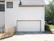 This home has a spacious white garage door, complementing the exterior and adding to the property's curb appeal at 1630 Reindeer Rdg, Alpharetta, GA 30005