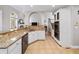 Eat-in kitchen featuring granite countertops, white cabinetry, and stainless steel appliances at 1630 Reindeer Rdg, Alpharetta, GA 30005