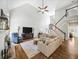 Bright living room featuring a fireplace, hardwood floors, and high ceilings at 1630 Reindeer Rdg, Alpharetta, GA 30005