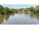Large pond offering serene views, mature trees, and a gazebo for residents to enjoy at 1630 Reindeer Rdg, Alpharetta, GA 30005