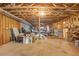 Unfinished basement with exposed ceiling and ample space for storage or recreation at 416 Spring Place Ne Rd, White, GA 30184