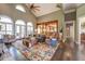 Living room with a stone fireplace, hardwood floors, and a view of the kitchen at 416 Spring Place Ne Rd, White, GA 30184