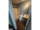 Bathroom with a shower and tub, wooden cabinet sink and vinyl flooring at 6470 Bedford Ln, Lithonia, GA 30058