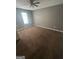 Bedroom with neutral walls, carpet flooring, and natural light at 6470 Bedford Ln, Lithonia, GA 30058