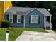 Charming single-story home featuring a well-maintained lawn and a private driveway at 6470 Bedford Ln, Lithonia, GA 30058