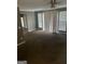 A bright living room with natural light, neutral walls and carpet flooring at 6470 Bedford Ln, Lithonia, GA 30058