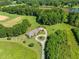 Expansive aerial view showcasing the home's large lot, circular driveway, and surrounding greenery at 226 Euharlee Five Forks Rd, Kingston, GA 30145