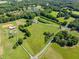 A captivating aerial view reveals the expansive property, featuring lush green fields and scattered trees with a private pond at 226 Euharlee Five Forks Rd, Kingston, GA 30145