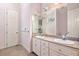 Bathroom featuring a double sink vanity with granite countertop and a large mirror at 226 Euharlee Five Forks Rd, Kingston, GA 30145