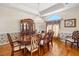 Formal dining room with a large wooden table, seating for eight, chandelier, and a decorative china cabinet at 226 Euharlee Five Forks Rd, Kingston, GA 30145
