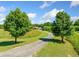 A long driveway leads to the home surrounded by beautiful, mature trees and greenery at 226 Euharlee Five Forks Rd, Kingston, GA 30145