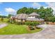 Beautiful brick home with mature landscaping, a three-car garage and circular driveway at 226 Euharlee Five Forks Rd, Kingston, GA 30145