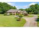 Lovely single Gathering home with a curved driveway, green lawn, and mature trees at 226 Euharlee Five Forks Rd, Kingston, GA 30145