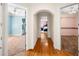 Hallway with hardwood floors and arched doorway offers access to bedrooms and bathrooms at 226 Euharlee Five Forks Rd, Kingston, GA 30145