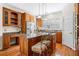 Kitchen with stainless steel appliances, granite countertops, central island with barstool seating, and wooden cabinets at 226 Euharlee Five Forks Rd, Kingston, GA 30145