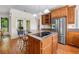 Kitchen featuring granite countertops, stainless steel appliances, and an island with cooktop and barstool seating at 226 Euharlee Five Forks Rd, Kingston, GA 30145