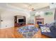 Living room features a fireplace, TV, plush seating, and windows providing ample natural light at 226 Euharlee Five Forks Rd, Kingston, GA 30145