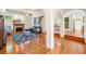 Spacious living room with hardwood floors, fireplace, and open archways leading to other rooms at 226 Euharlee Five Forks Rd, Kingston, GA 30145